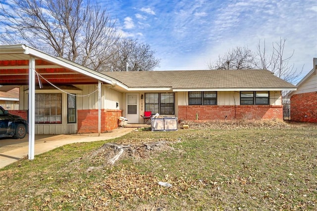 1008 Juniper Ave, Oklahoma City, OK 73130 - exterior space with board and batten siding, brick siding, roof with shingles, and a carport
