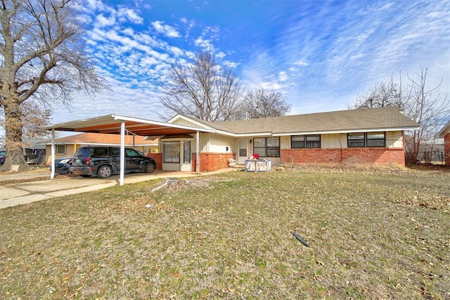 1008 Juniper Ave, Oklahoma City, OK 73130 - view of front of property with brick siding, driveway, and a carport