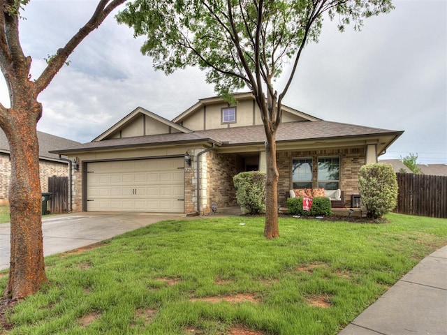 single story home featuring fence, a front yard, driveway, and a garage