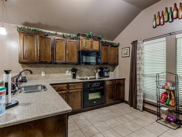 kitchen with a sink, light tile patterned floors, backsplash, vaulted ceiling, and black appliances