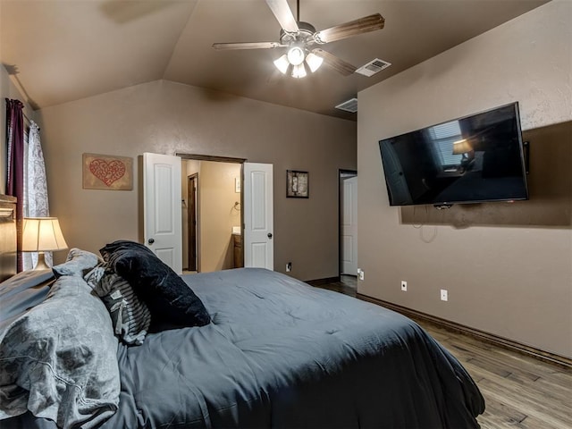 bedroom featuring visible vents, wood finished floors, lofted ceiling, baseboards, and ceiling fan