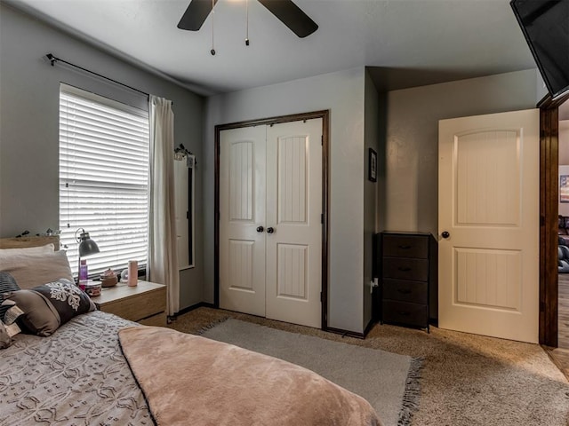 bedroom with carpet flooring, ceiling fan, and a closet