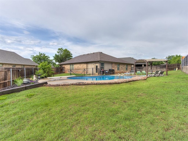 view of swimming pool with a fenced backyard, a fenced in pool, and a lawn