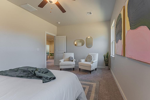 carpeted bedroom featuring baseboards, ceiling fan, and visible vents