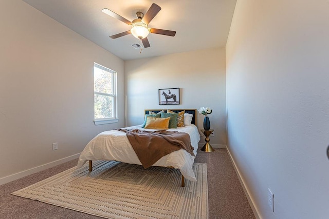 bedroom with baseboards, carpet flooring, and a ceiling fan
