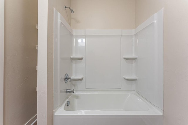 bathroom featuring a textured wall