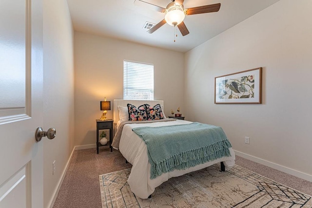 carpeted bedroom featuring baseboards, ceiling fan, and visible vents