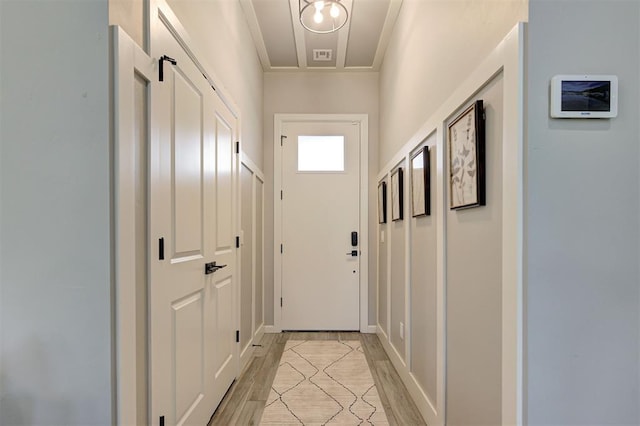 entryway featuring ornamental molding