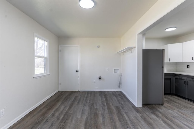 laundry room with gas dryer hookup, laundry area, hookup for a washing machine, and wood finished floors