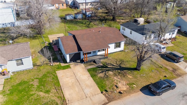 birds eye view of property with a residential view