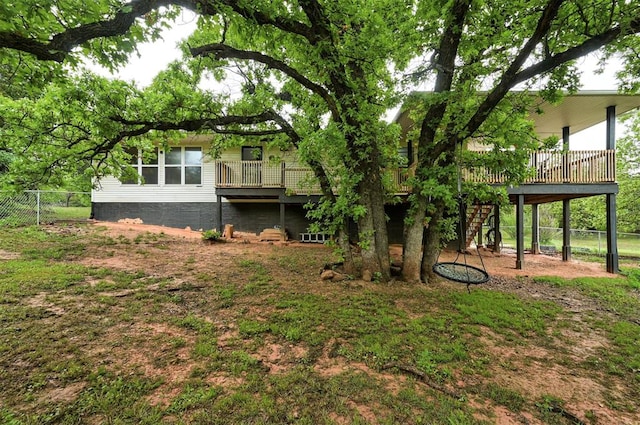 view of yard with stairway, fence, and a wooden deck