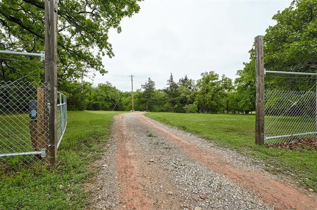 view of road featuring a gated entry