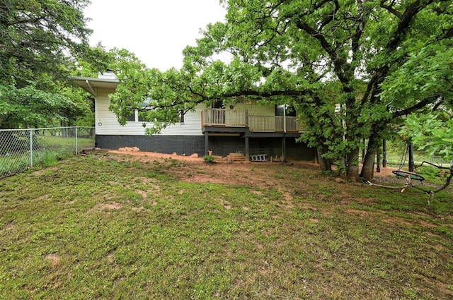 view of yard with fence and a deck