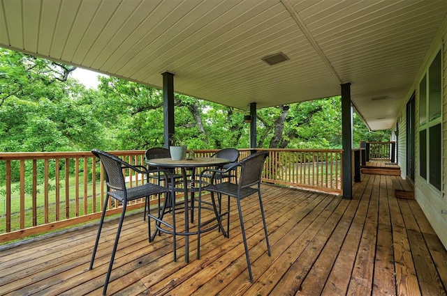 deck with outdoor dining space