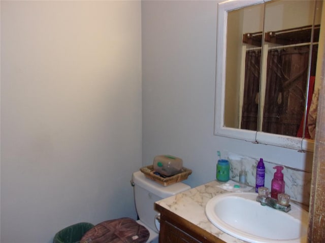 half bath with toilet and vanity