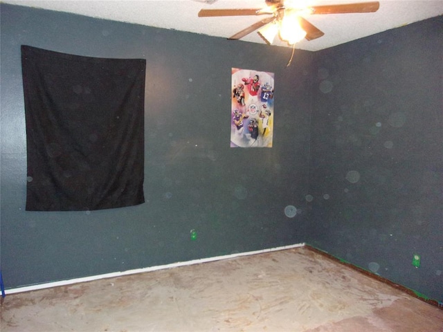 spare room with ceiling fan