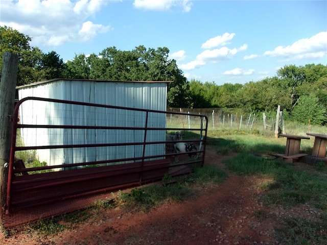 view of outdoor structure with fence