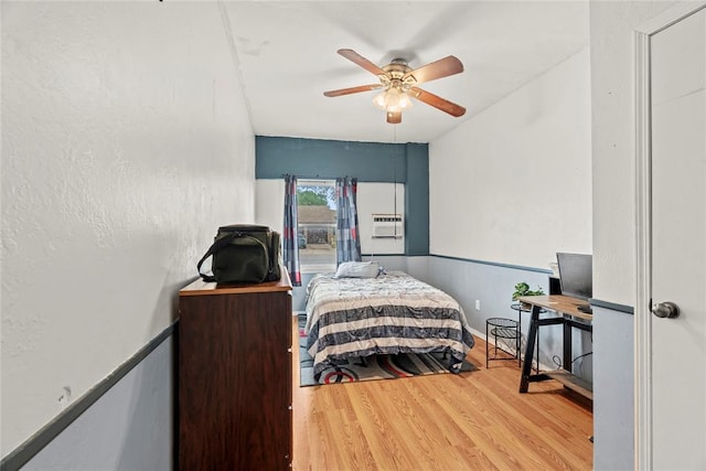 bedroom featuring a ceiling fan and wood finished floors