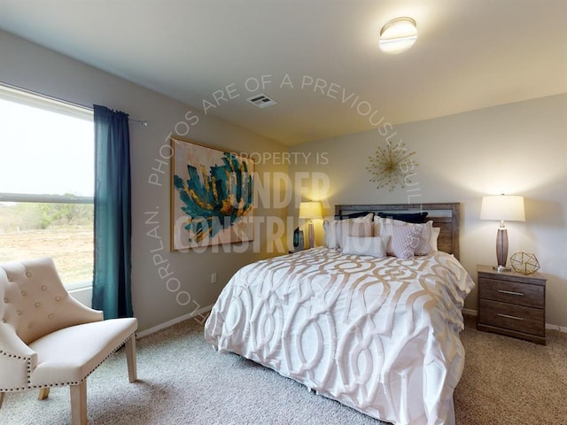 bedroom featuring vaulted ceiling, baseboards, carpet flooring, and visible vents