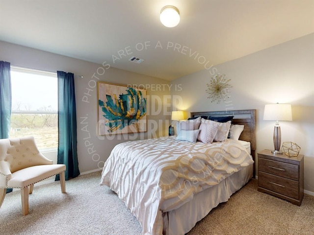 bedroom featuring light colored carpet, baseboards, visible vents, and vaulted ceiling