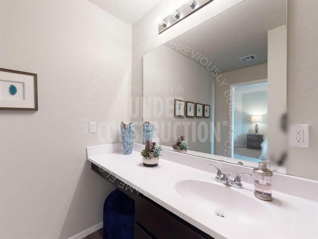 bathroom featuring vanity and visible vents