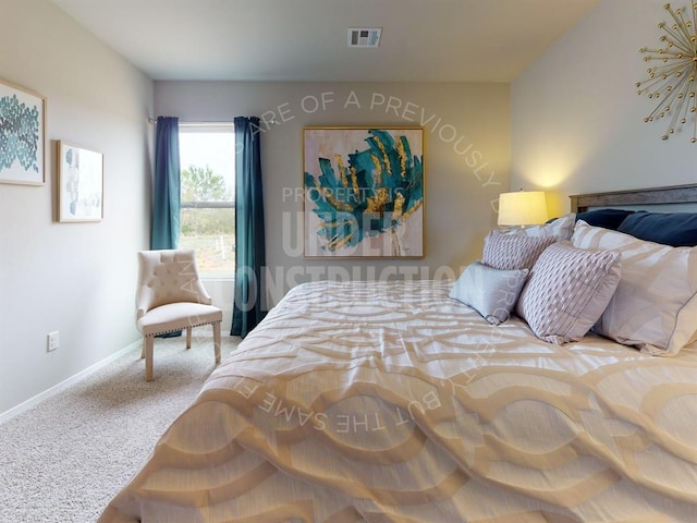 carpeted bedroom with visible vents and baseboards