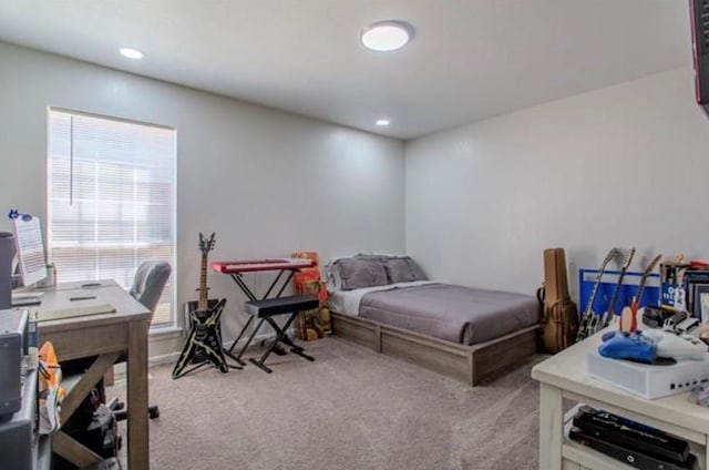 carpeted bedroom with recessed lighting