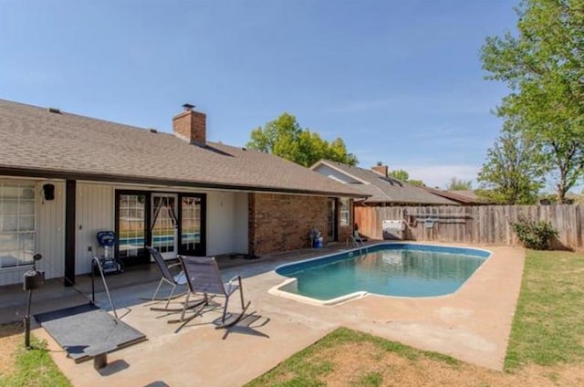 view of pool featuring a patio, a fenced backyard, and a fenced in pool
