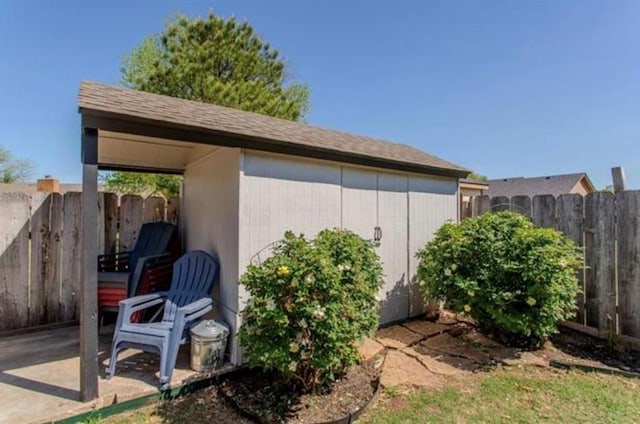 view of outbuilding with fence