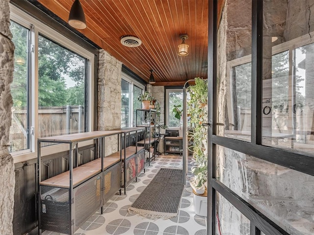 sunroom / solarium with visible vents and a wealth of natural light