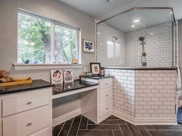 full bath with plenty of natural light and tiled shower