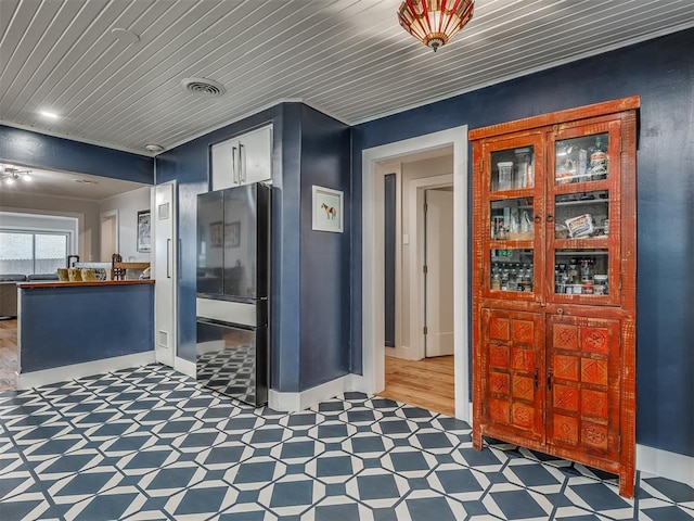 interior space featuring tile patterned floors and visible vents
