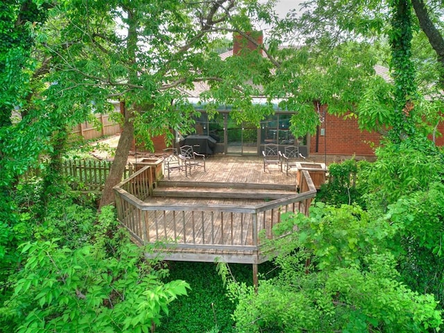 deck with fence and a grill