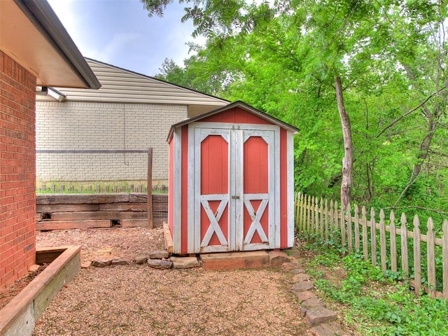 view of shed featuring a fenced backyard