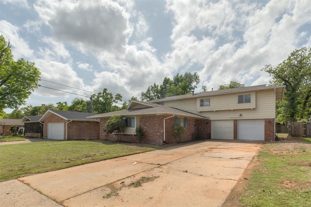 view of front of home with concrete driveway, brick siding, a front yard, and a garage