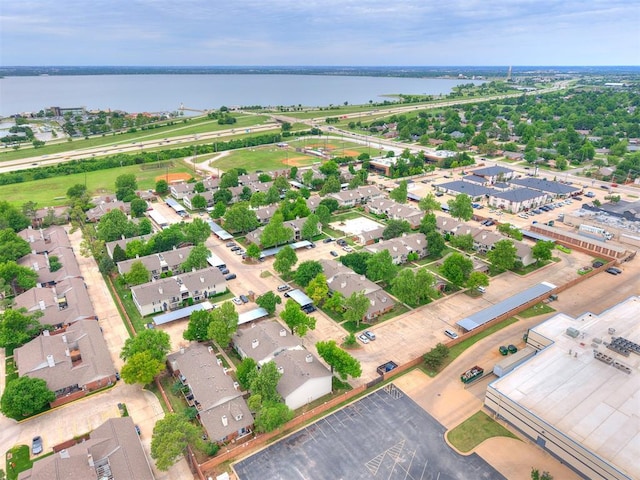 drone / aerial view with a water view and a residential view