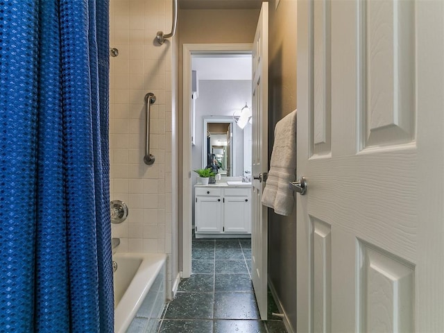 bathroom with baseboards, tile patterned flooring, vanity, and shower / bath combo