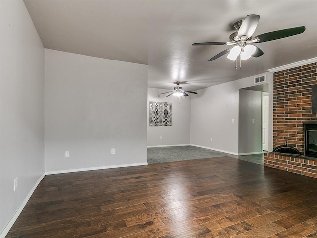 unfurnished living room featuring baseboards, ceiling fan, wood-type flooring, and visible vents