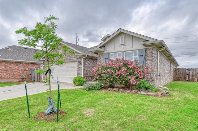 1114 Old Frisco Rd, Norman, OK 73069 - ranch-style house featuring fence, an attached garage, concrete driveway, and a front lawn