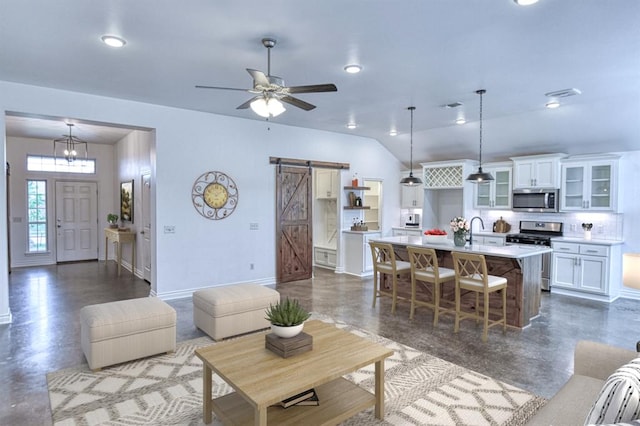 1114 Old Frisco Rd, Norman, OK 73069 - living room featuring baseboards, a barn door, a ceiling fan, and lofted ceiling