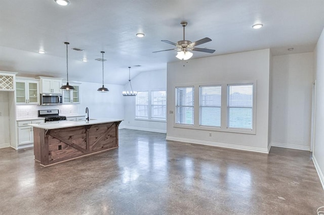 1114 Old Frisco Rd, Norman, OK 73069 - kitchen with finished concrete floors, baseboards, ceiling fan, and stainless steel appliances