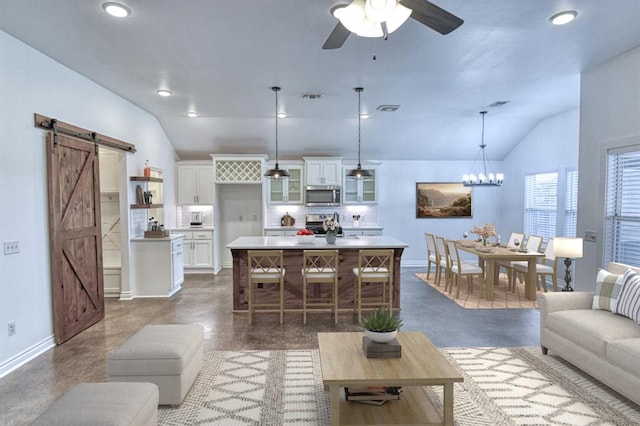 1114 Old Frisco Rd, Norman, OK 73069 - living area with a barn door, ceiling fan with notable chandelier, baseboards, lofted ceiling, and visible vents