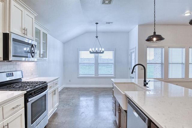 1114 Old Frisco Rd, Norman, OK 73069 - kitchen with a sink, appliances with stainless steel finishes, finished concrete floors, and a healthy amount of sunlight