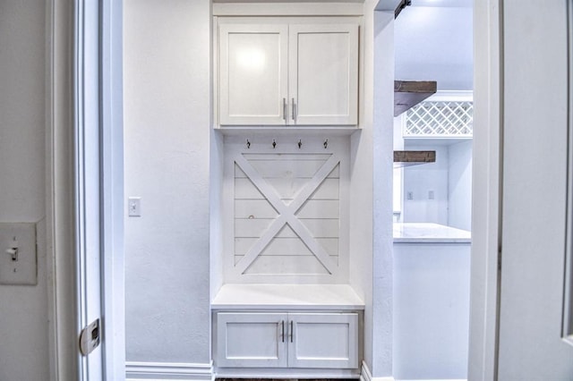 1114 Old Frisco Rd, Norman, OK 73069 - mudroom featuring baseboards and a textured wall