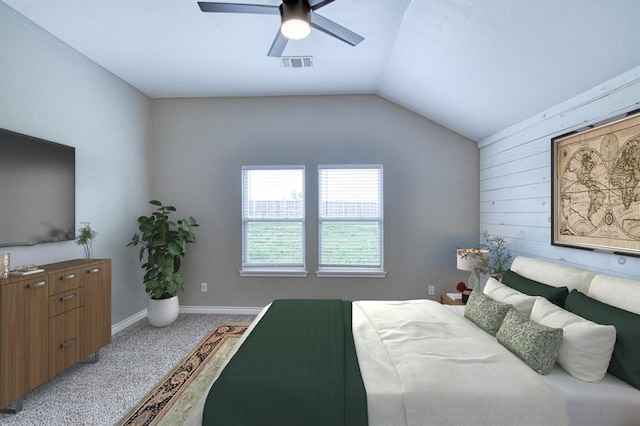 1114 Old Frisco Rd, Norman, OK 73069 - bedroom with ceiling fan, visible vents, wood walls, carpet floors, and lofted ceiling