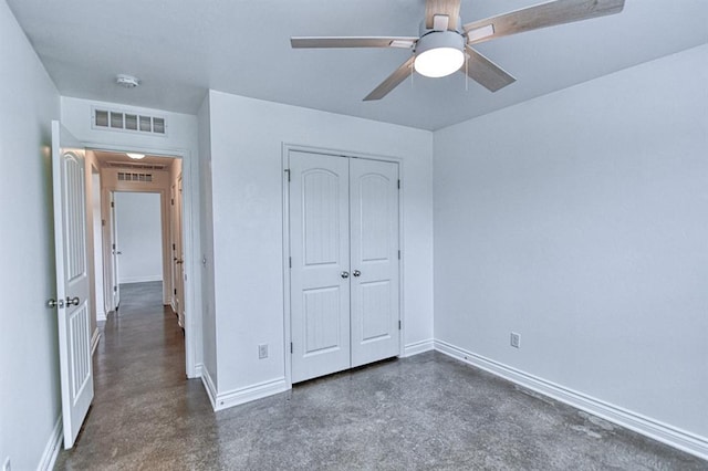 1114 Old Frisco Rd, Norman, OK 73069 - unfurnished bedroom with visible vents, baseboards, concrete flooring, and a closet