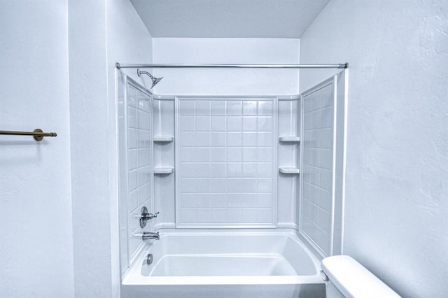 1114 Old Frisco Rd, Norman, OK 73069 - full bathroom featuring a textured wall, toilet, and shower / bathing tub combination