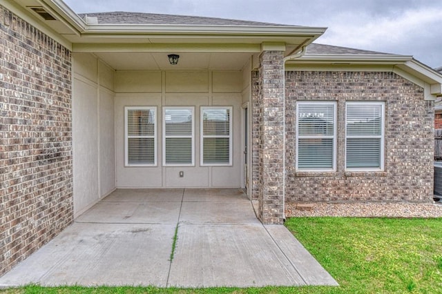 1114 Old Frisco Rd, Norman, OK 73069 - exterior space featuring a yard, brick siding, a patio area, and roof with shingles