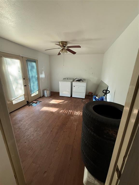 interior space with separate washer and dryer, a ceiling fan, dark wood finished floors, and french doors