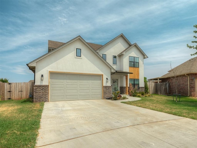 view of front of house featuring concrete driveway, brick siding, fence, and a front yard